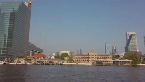 Slowmotion view of Chao phraya river in bangkok while in boat with bangkok hi Stock Footage 200388033