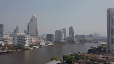 Slowmotion view of Chao phraya river in bangkok with bangkok higrise building Stock Footage 206761832