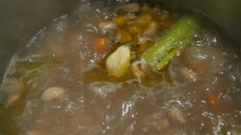 Slowmotion view of vegetable bean soup boiling on a cooking pot,healthy eat food Stock Footage 231002168