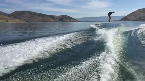 SLOWMOTION: Wakeboarding Toeside frontside 360 wake to wake Stock Footage 54708773