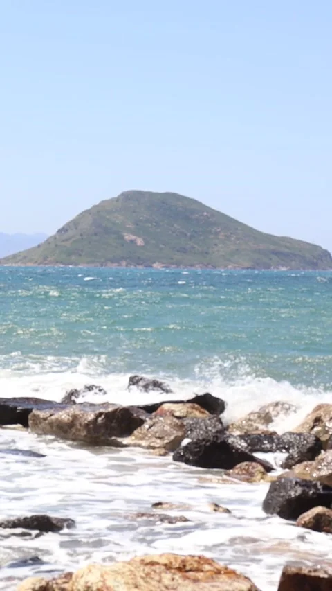 Slowmotion Waves Crashing on the Rocks (Vertical) Stock Footage 236658835