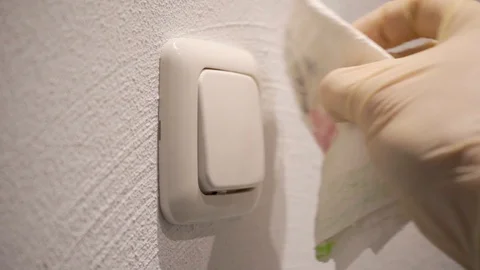 Slowmotion Wearing Gloves Cleaning Light Switch Video stock 128155191