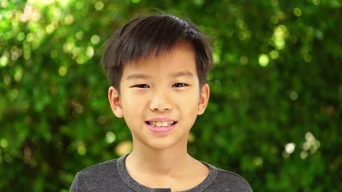 Slowmotion zoom in smiling boy Stock Footage 90507902