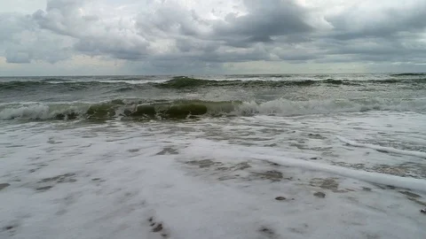 SlowMotionWavesBreakingon Beach CloudyDay Stock Footage 98306513