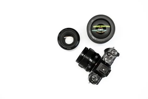 SLR camera on a white background with a set lenses  Stock Photos