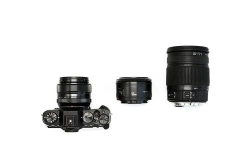 SLR camera on a white background with a set lenses  Stock-Fotos