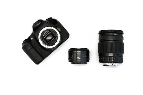 SLR camera on a white background with a set lenses  Stock Photos