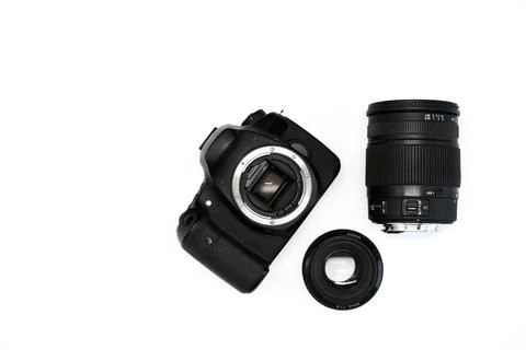 SLR camera on a white background with a set lenses  Stock Photos