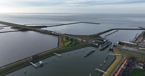 Sluice and lock complex at the Afsluitdijk, Lorentzsluices, aerial drone view. 動画素材 304130506