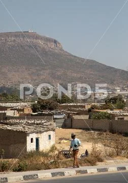 Slum at the foot of the chris rei statue, Huila Province, Lubango, Angola Stock Photos