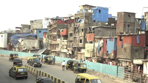 Slum residential building and  busy road, Mumbai, IndiaStock Footage