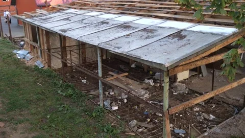 Slums, abandoned building or structure in the city with garbage around. Stock Footage 286046972