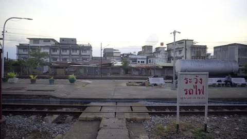 Slums with small old broken buildings near railway station Stock Footage 133125214