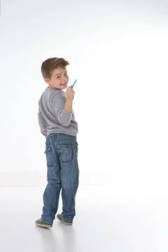 Sly child smiling to the camera Stock Photos
