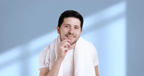 A sly man brushing his teeth with a small interdental brush. A young man doing Stock Footage 235369279