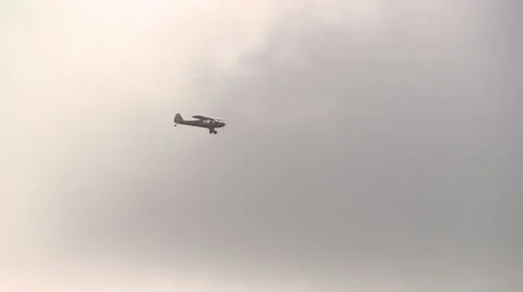 Smaill plane flying in heavy cloud Stock Footage