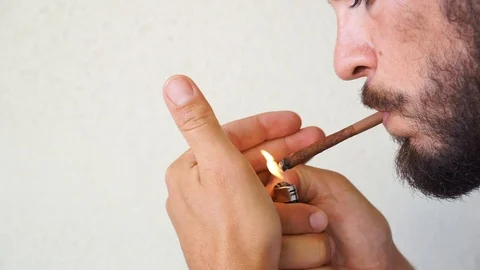 Smaking small cigars Stock Footage 112203430