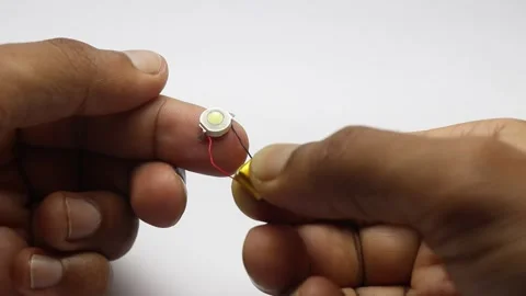 Small 1W LED is connected to a mini battery that is rechargeable Video stock 310822218