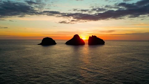 Small 3 islands in the mountains at sunset view from a drone Stock Footage 256576551