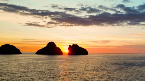 Small 3 islands in the mountains at sunset view from a drone Stock Footage 256576598