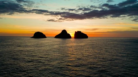 Small 3 islands in the mountains at sunset view from a drone Stock Footage 256576609