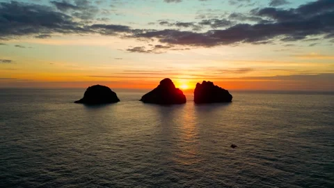 Small 3 islands in the mountains at sunset view from a drone Stock Footage 256888416