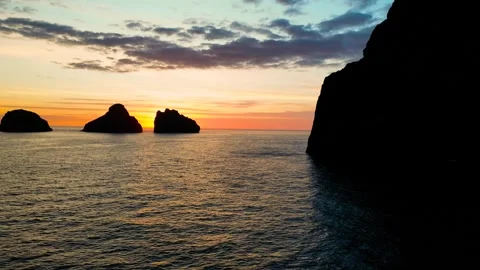 Small 3 islands in the mountains at sunset view from a drone Stock Footage 256888654