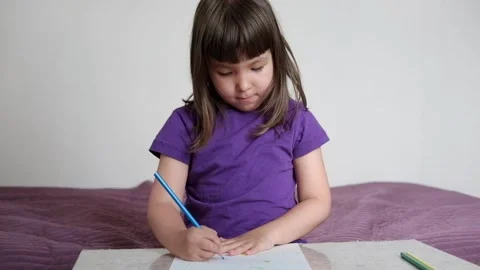 A small 4-year-old child plays video games on a smart phone. Stock Footage 133218231