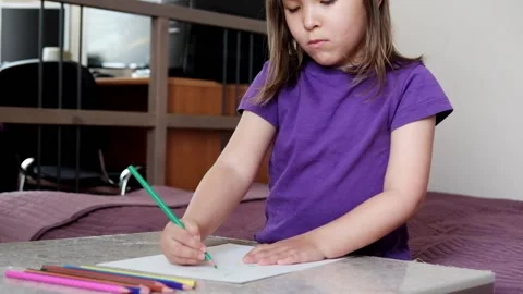 A small 4-year-old child plays video games on a smart phone. Stock Footage 133218236