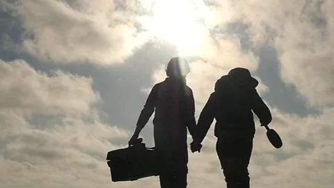 Small 5-6 years old boy and girl helpers with working tools silhouettes slomo Stock Footage 197424997