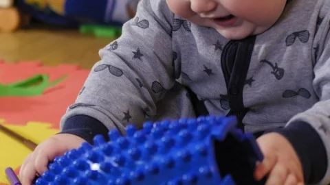 Small 9 month years old child taking on an orthopedic mat Stock Footage 127117001