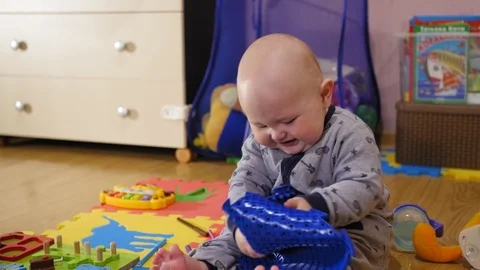 Small 9 month years old child taking on an orthopedic mat Stock Footage 127117199