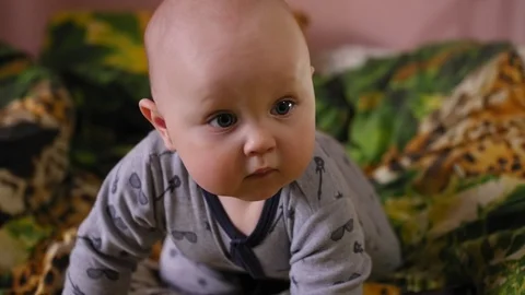 Small 9 month years old child taking on an orthopedic mat Stock Footage 127117373