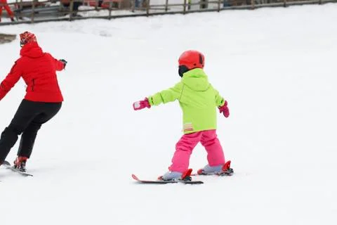 Small active child skiing on snow slope Stock Photos