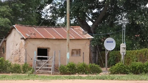 Small adobe house with satellite dish Stock Footage 95496639