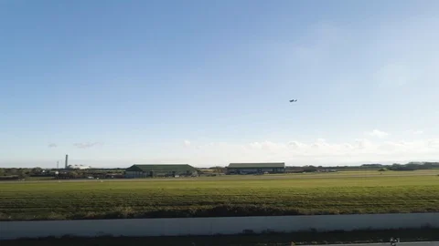 Small aeroplane tacking off from airport. Plane climbs into sky, drone aerial 4K Video stock 101183204