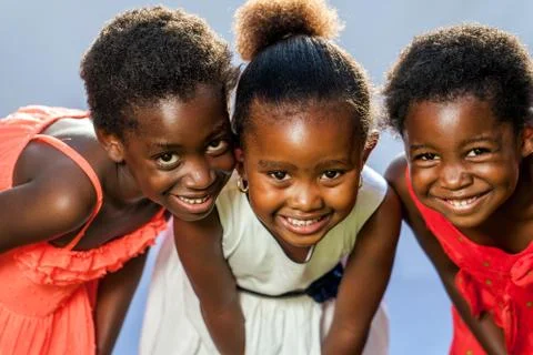 Small african girls joining heads. Stock Photos
