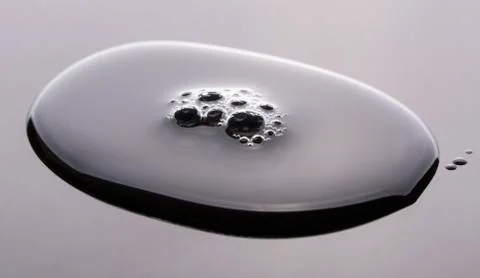 Small air bubbles on a big drop Stock Photos
