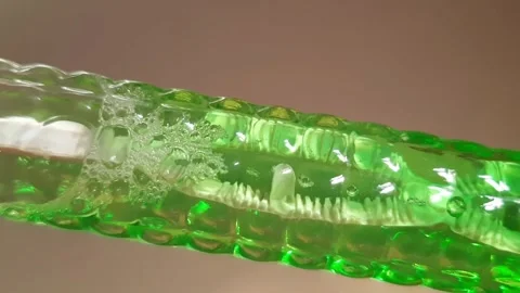Small Air Bubbles Moving and Joining Larger Bubbles in Liquid Vídeo Stock 343731766