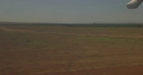 Small Air Kenya aircraft taking off from Keekorok airstrip in Maasai Mara Stock Footage 81561209