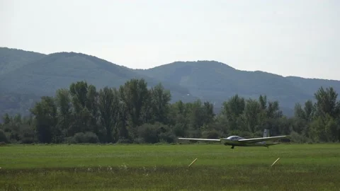 Small air-plane glider taking off from the airfield Stock Footage 140270976