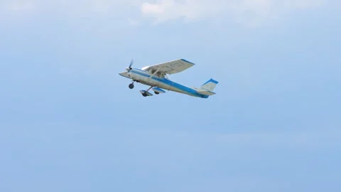 Small aircraft model Cessna flying over airport. Small private single engin.. Stock Footage 247742287