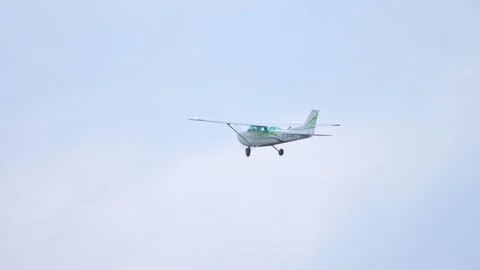 Small aircraft model Cessna flying over airport. Small private single engin.. Stock Footage 253745408