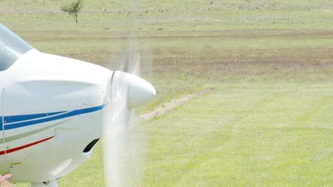 Small aircraft ready to fly on track in a small civil airdrome Stock Footage 107862217