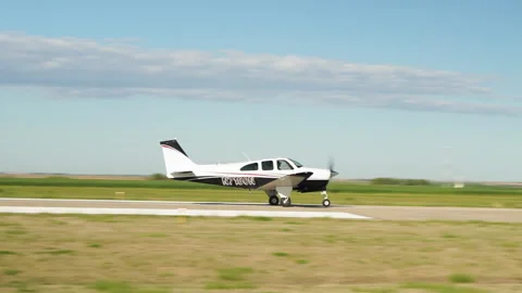 Small aircraft taking off from runway Vídeo Stock 171725416