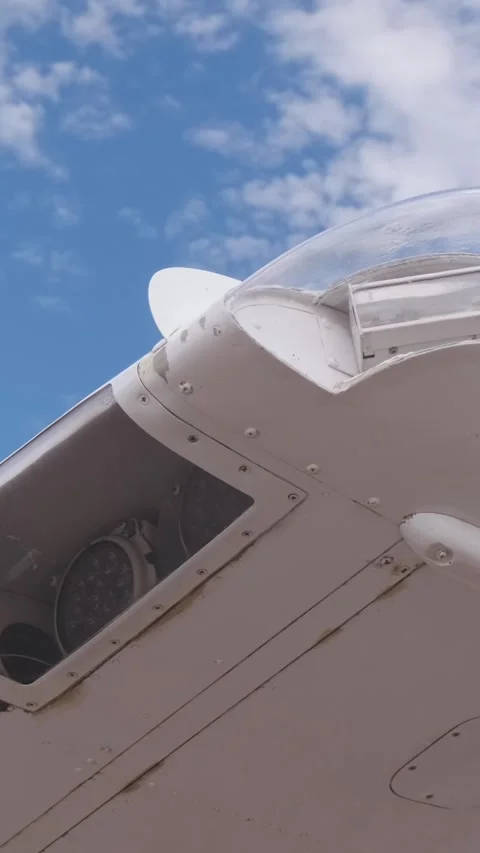 Small Aircraft Wing Tip with Navigation and Landing Lights Illuminated During Video stock 338378855