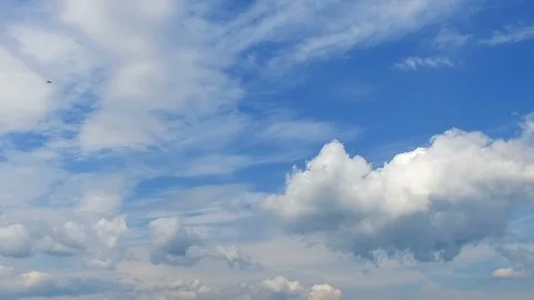 Small airplane on blue cloudy sky Stock Footage 102889082