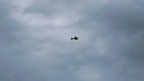 Small airplane flying in clouds slow motion 4K sky background aviation footage Stock Footage 316403369