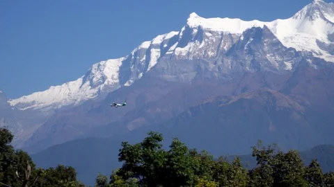 Small Airplane Flying Over Himalayan Mountain Range Stock Footage 99217958