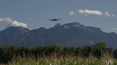 Small airplane flying over mountains Stock Footage 263264112